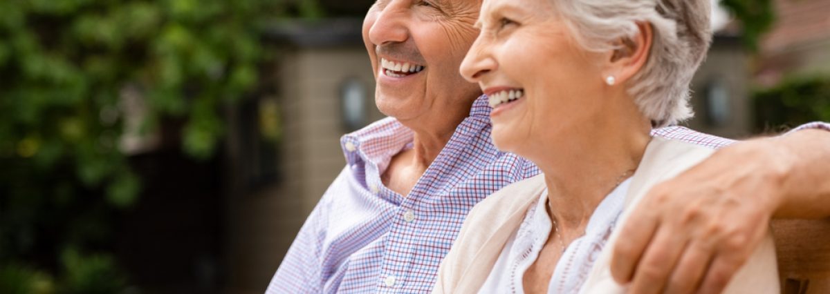 Senior,Couple,Sitting,Together,On,Bench,At,Park.,Elderly,Married